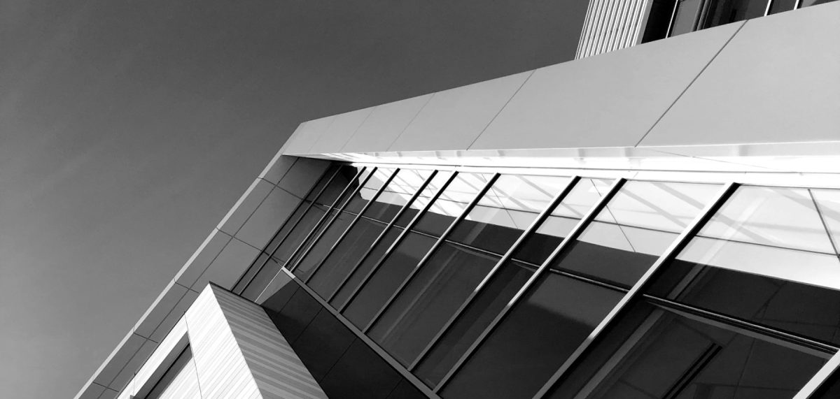 A black and white photo of a modern building.