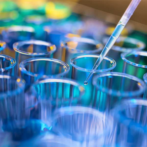 A test tube in a laboratory with liquid in it.